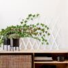 Decorative geometric trellis for outdoor privacy installed in a garden setting for modern style and shade
