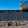 Grey metal corrugated fence in Jack Matrix Fence Extension Ferns 1810x450mm Charcoal
